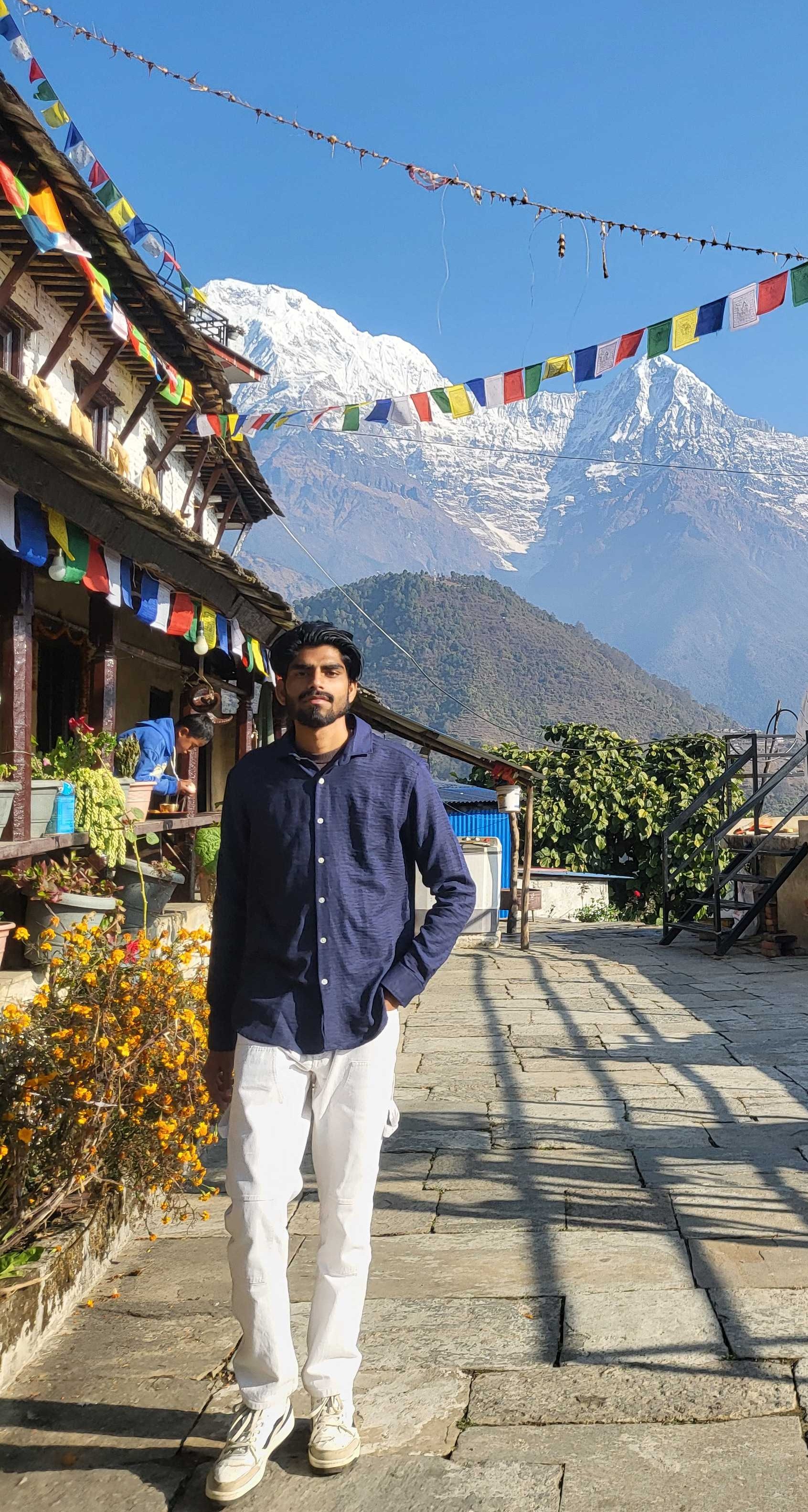 Traveller at Ashwin Homestay Ghandruk Nepal with Himalayan mountain view and traditional village background