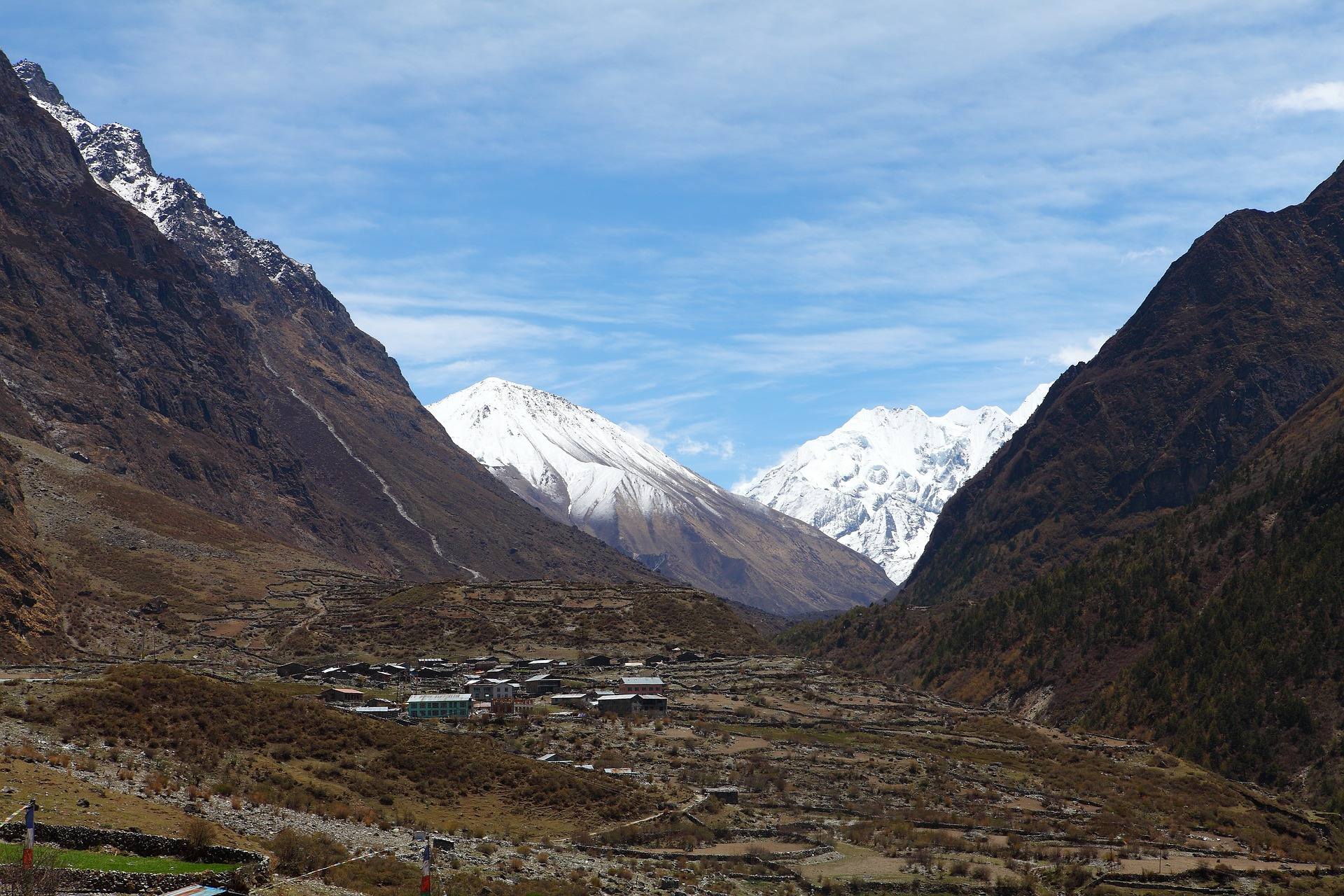 Panoramic view of a remote Himalayan village landscape located in a deep valley on Kanchenjunga route 