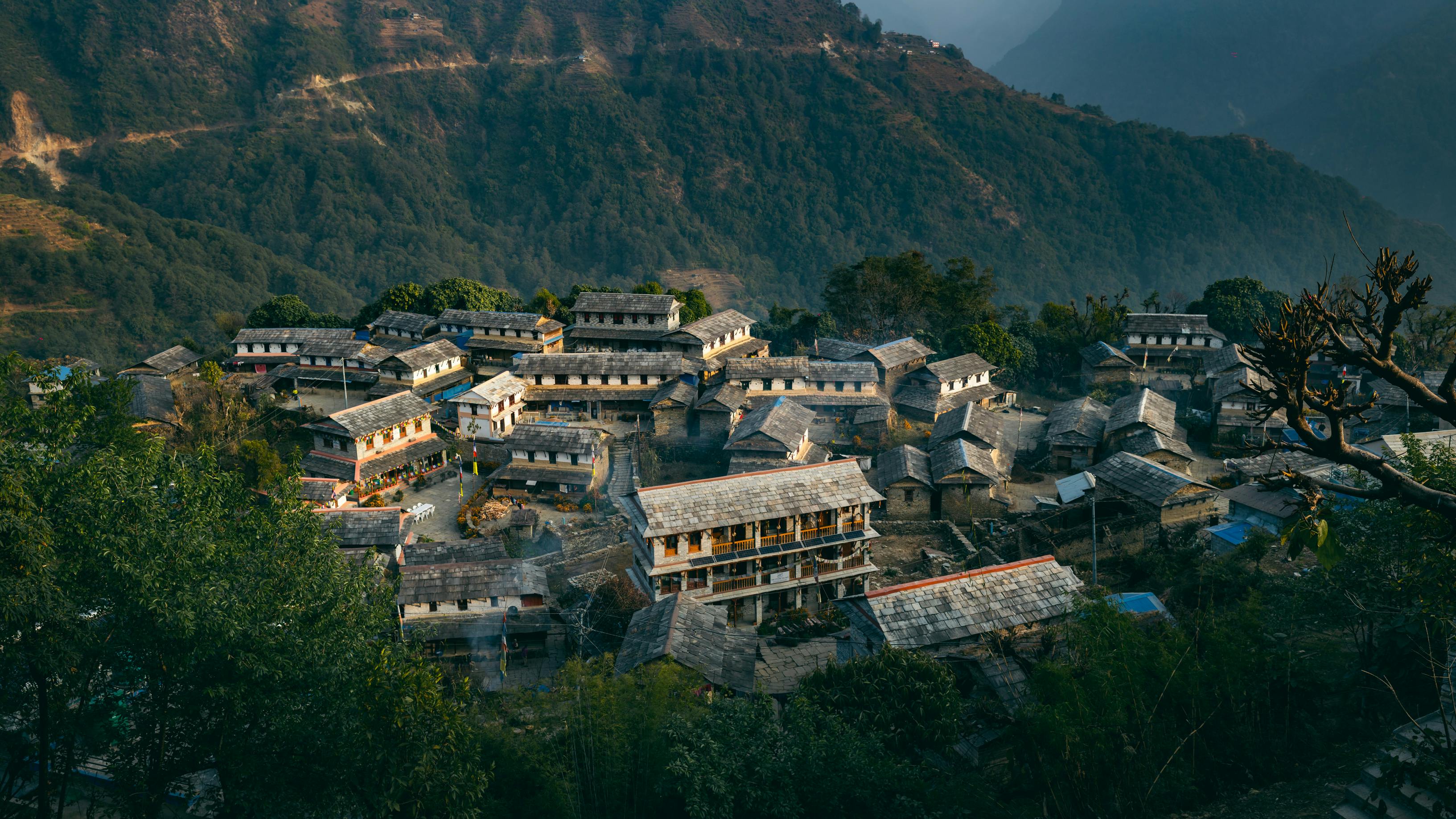Ghandruk Village traditional stone houses with Himalayan mountain backdrop Annapurna region Nepal