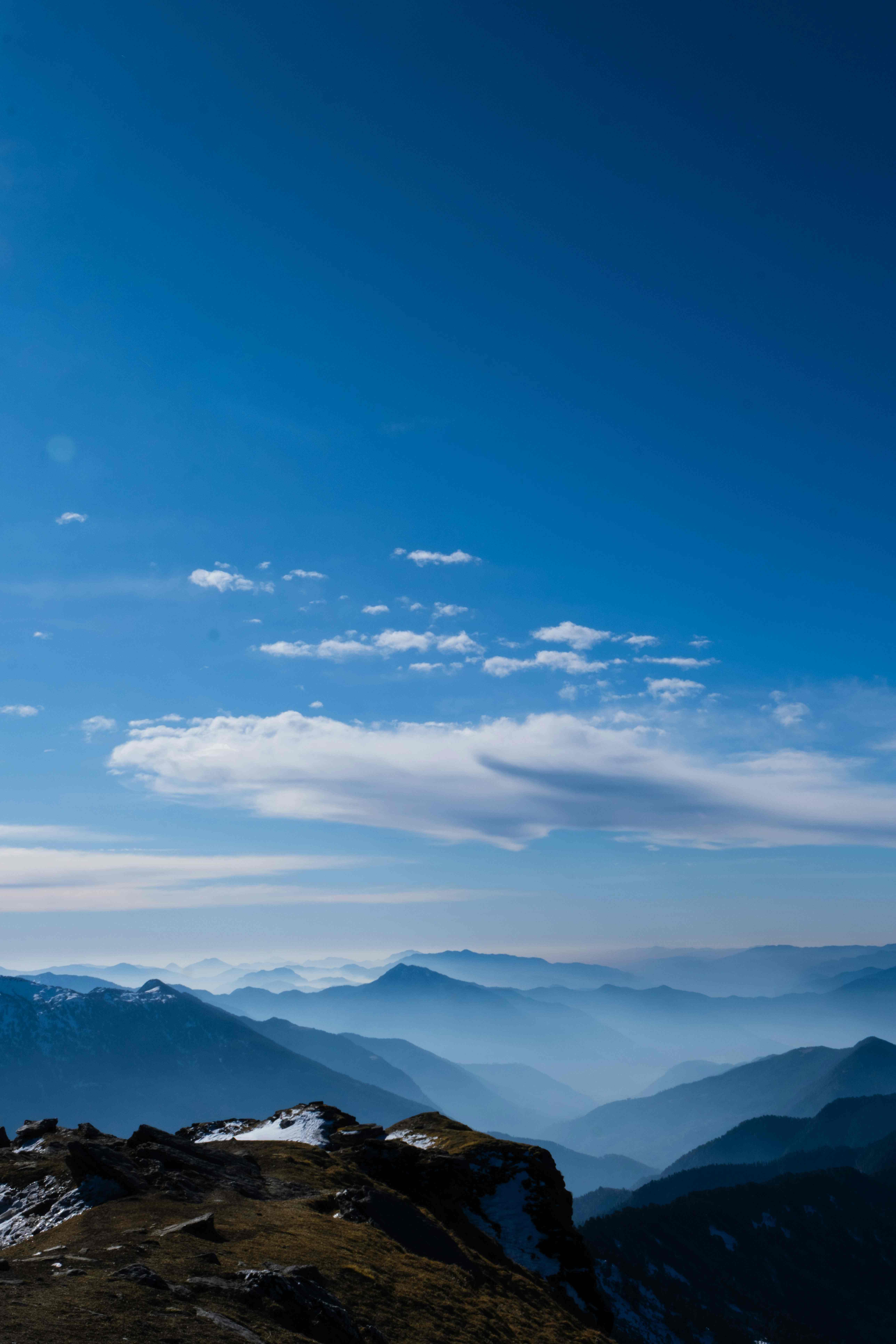 Morning view from Kedarkantha Summit overlooking Himalayan valleys and ridges