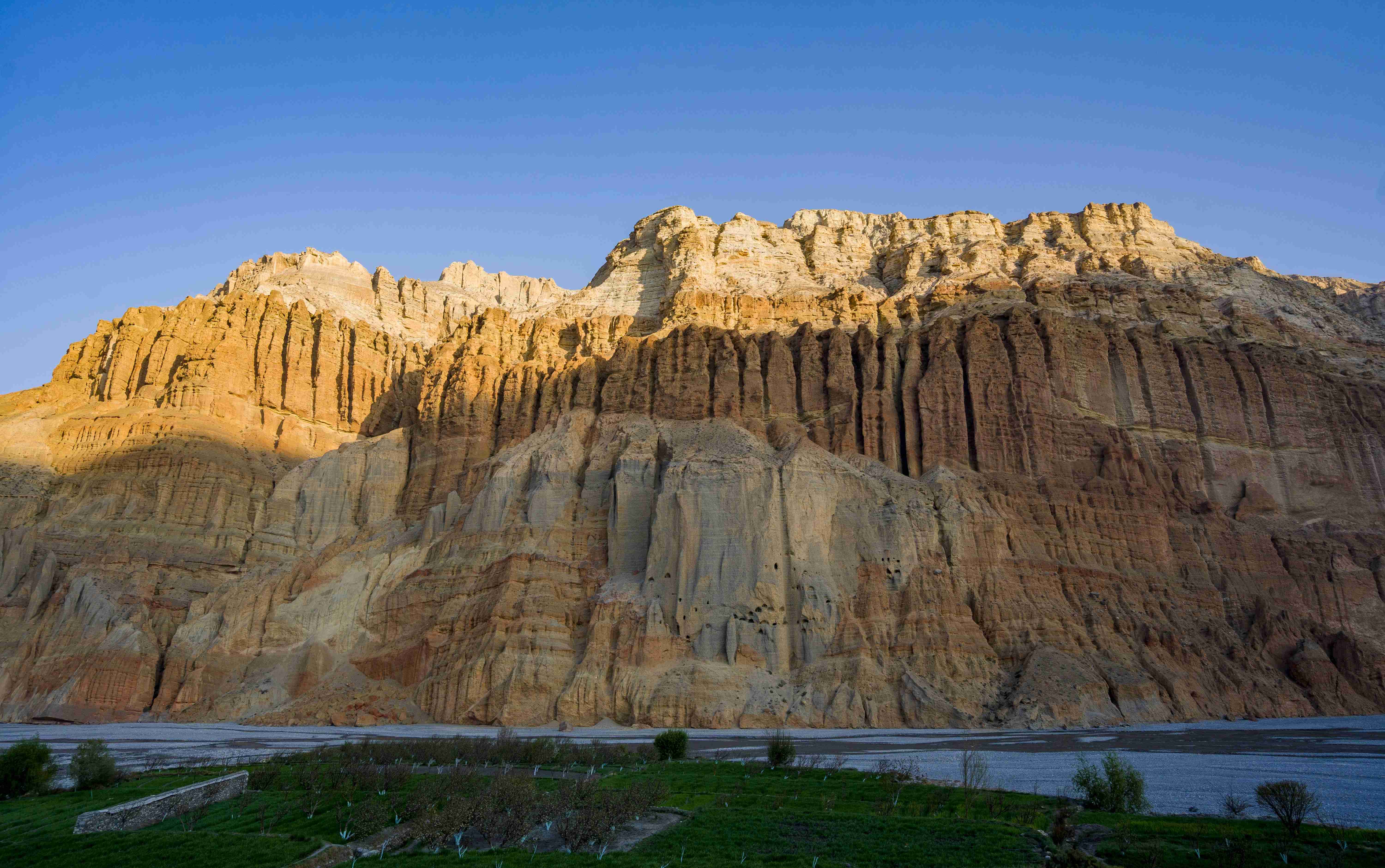 Massive red and white rock cliffs in Upper Mustang near Kali Gandaki Valley, Nepal