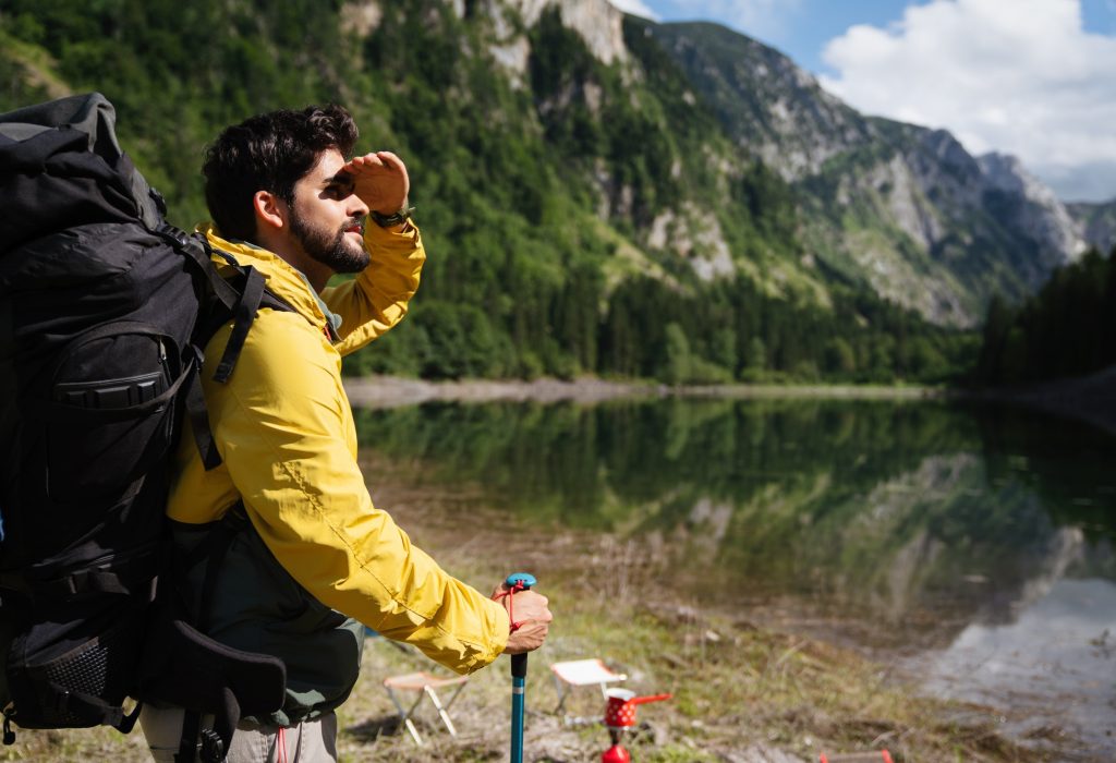 active-hiker-hiking-enjoying-the-view-looking-at-mountain-landscape.jpg